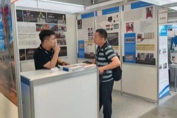 Zhongde Dingli team showcasing static hydraulic rock breaking equipment and mining machinery at international exhibition